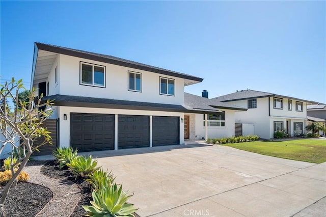 3130 E Craig Dr, Orange, CA 92869 - view of front of home featuring an attached garage, stucco siding, driveway, and a front lawn