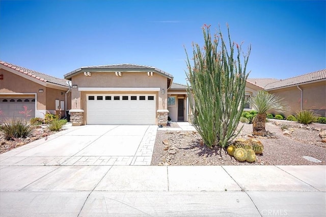 19472 Crystal Springs Ln, Apple Valley, CA 92308 - view of front of home with a garage, stucco siding, concrete driveway, and stone siding