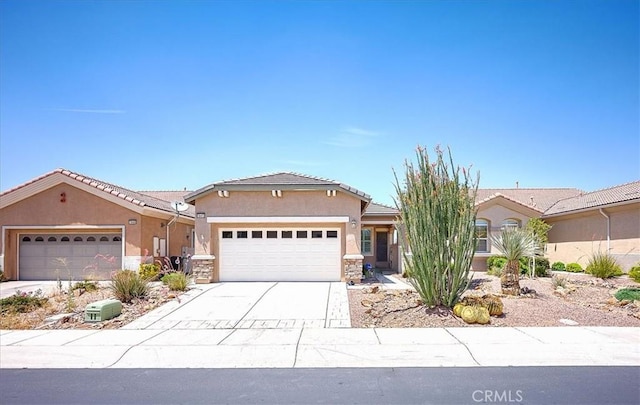 19472 Crystal Springs Ln, Apple Valley, CA 92308 - view of front of property featuring an attached garage, stucco siding, driveway, and stone siding