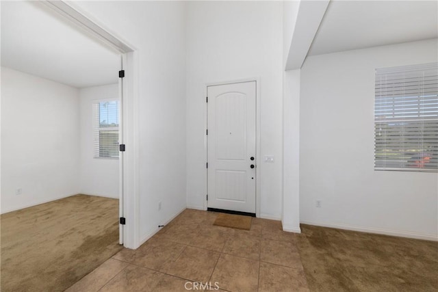 22364 Driftwood Ct, Saugus, CA 91350 - carpeted entryway with tile patterned floors and baseboards