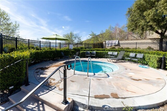 22364 Driftwood Ct, Saugus, CA 91350 - view of swimming pool featuring a patio and a fenced backyard