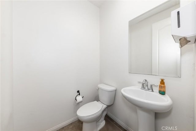 22364 Driftwood Ct, Saugus, CA 91350 - half bathroom featuring baseboards, a sink, and toilet