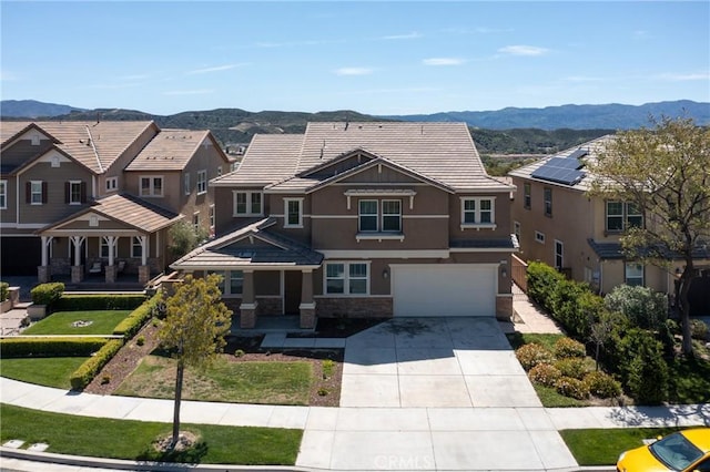 22364 Driftwood Ct, Saugus, CA 91350 - view of front of house featuring concrete driveway, stucco siding, a mountain view, stone siding, and an attached garage