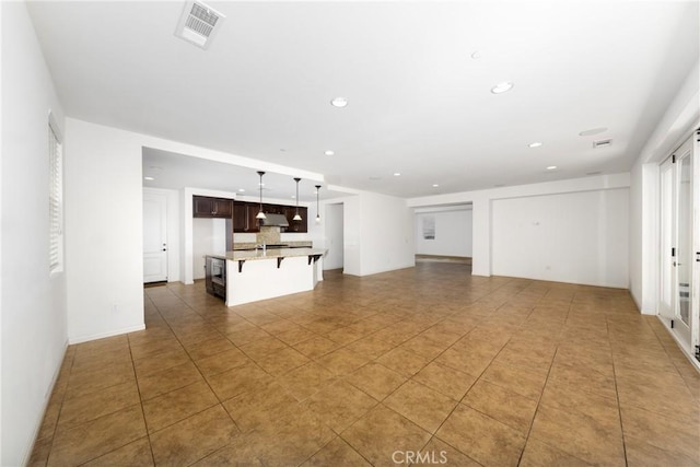22364 Driftwood Ct, Saugus, CA 91350 - unfurnished living room featuring recessed lighting, light tile patterned floors, and visible vents
