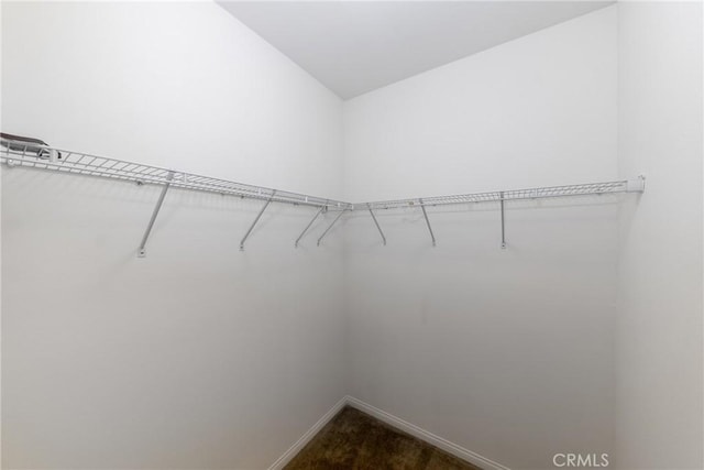22364 Driftwood Ct, Saugus, CA 91350 - walk in closet featuring dark colored carpet