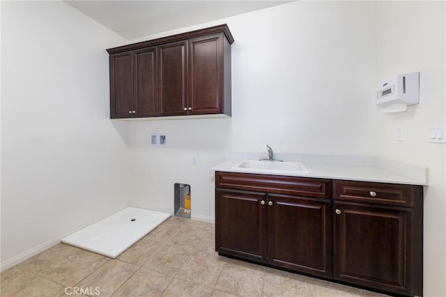22364 Driftwood Ct, Saugus, CA 91350 - washroom with baseboards, light tile patterned floors, hookup for a washing machine, cabinet space, and a sink