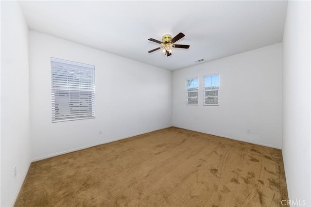 22364 Driftwood Ct, Saugus, CA 91350 - empty room featuring carpet floors, a ceiling fan, and visible vents