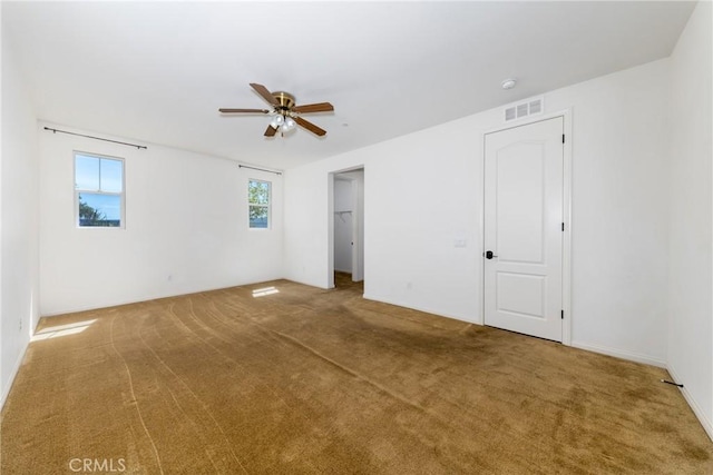 22364 Driftwood Ct, Saugus, CA 91350 - unfurnished bedroom with a spacious closet, carpet flooring, visible vents, and a ceiling fan