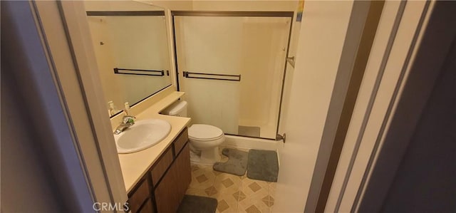 643 W Villa Chaparral Rd, San Jacinto, CA 92583 - bathroom with a shower stall, tile patterned floors, vanity, and toilet