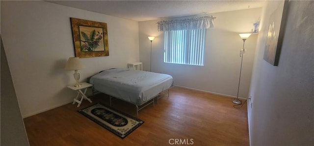 643 W Villa Chaparral Rd, San Jacinto, CA 92583 - bedroom with wood finished floors and baseboards