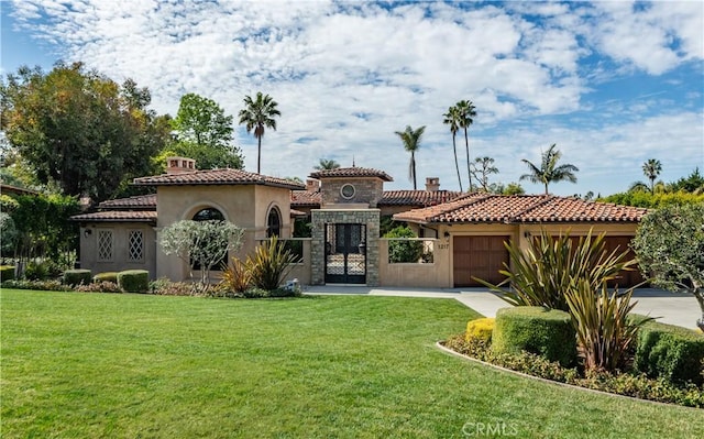 1217 Granvia Altamira, Palos Verdes Estates, CA 90274 - mediterranean / spanish home with a garage, a front yard, stucco siding, and a tile roof