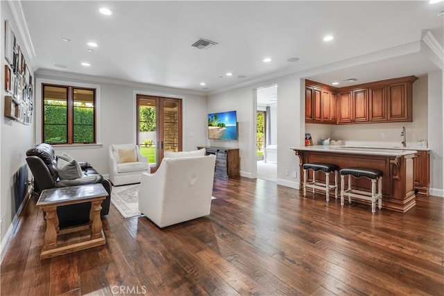 1217 Granvia Altamira, Palos Verdes Estates, CA 90274 - living area with wet bar, ornamental molding, recessed lighting, dark wood-style floors, and visible vents