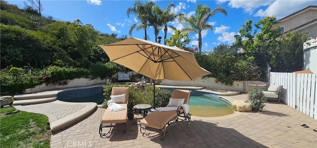 view of swimming pool with fence, a patio area, and a fenced in pool