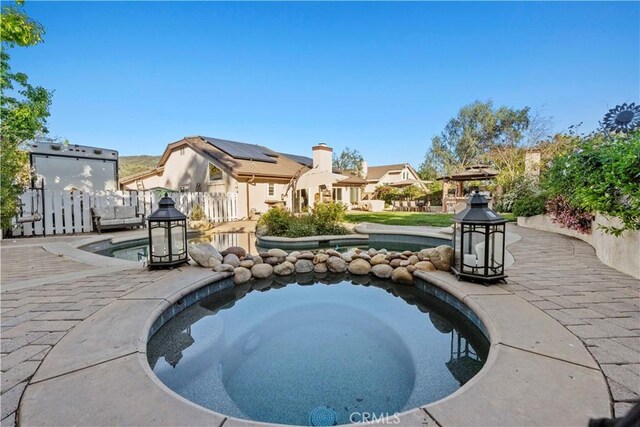 view of pool featuring fence, a patio area, and a fenced in pool