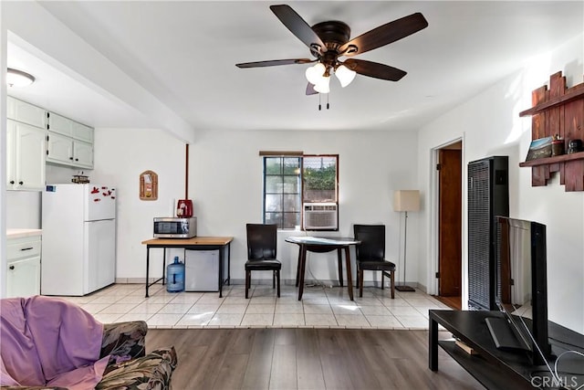 3580 Griffin Ave, Los Angeles, CA 90031 - living room featuring ceiling fan, cooling unit, a heating unit, baseboards, and light wood finished floors