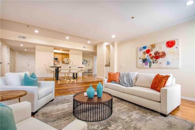 12011 Goshen Ave Unit 203, Los Angeles, CA 90049 - living area featuring recessed lighting, baseboards, visible vents, and light wood-style flooring