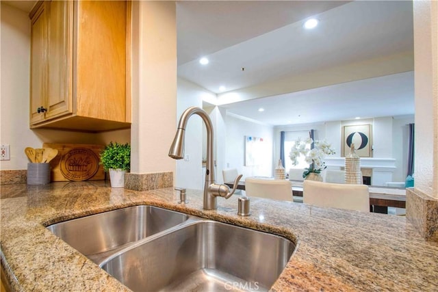 12011 Goshen Ave Unit 203, Los Angeles, CA 90049 - room details with recessed lighting, light stone counters, and a sink