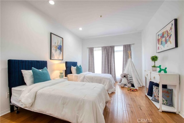 12011 Goshen Ave Unit 203, Los Angeles, CA 90049 - bedroom featuring recessed lighting, baseboards, and hardwood / wood-style floors
