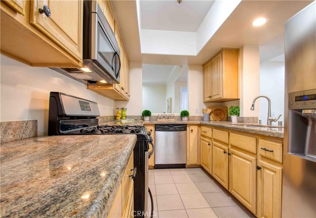12011 Goshen Ave Unit 203, Los Angeles, CA 90049 - kitchen with a sink, light tile patterned floors, stone counters, light brown cabinets, and stainless steel appliances