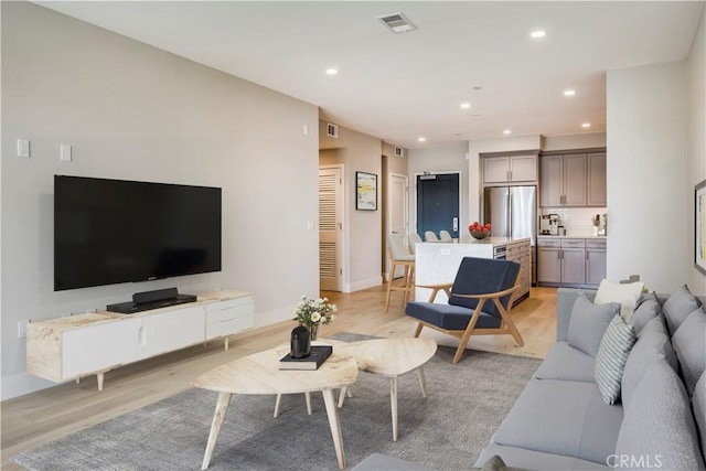 1920 S Pacific Coast Hwy Unit 213, Redondo Beach, CA 90277 - living area with light wood finished floors, baseboards, visible vents, and recessed lighting