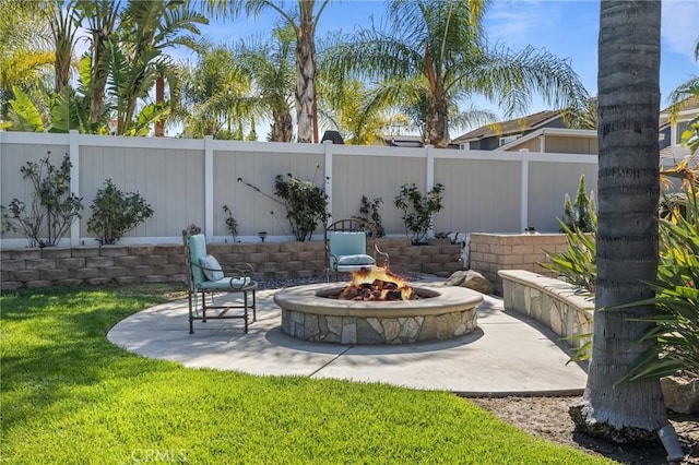 view of patio with a fenced backyard and an outdoor fire pit
