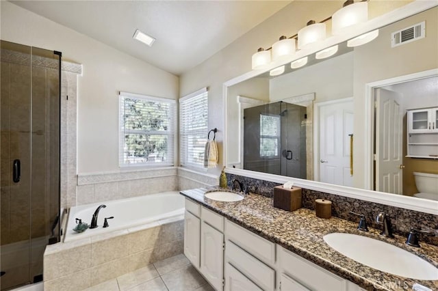 full bath featuring a shower stall, a sink, lofted ceiling, and visible vents