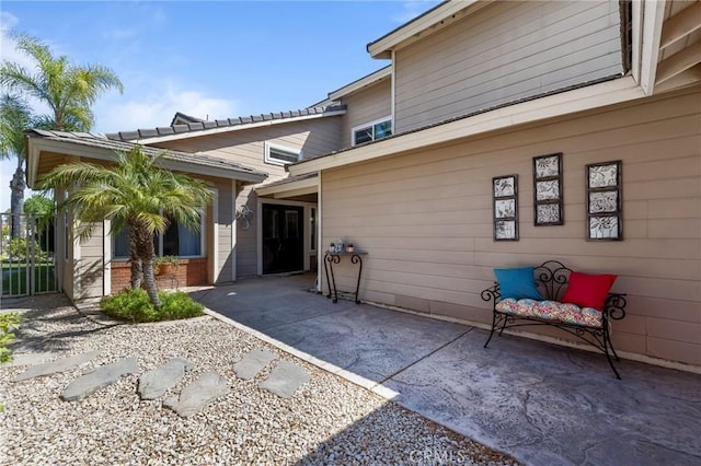 doorway to property featuring a patio area