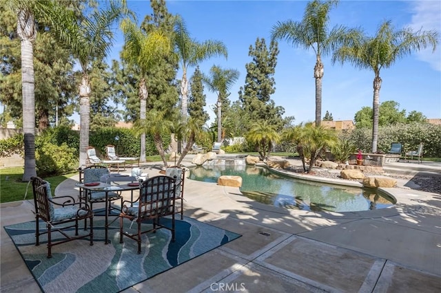 view of swimming pool featuring a patio area and a fenced in pool