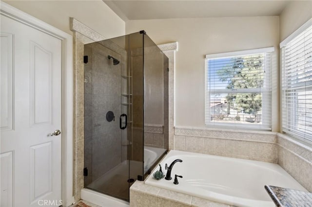 bathroom with a garden tub and a stall shower
