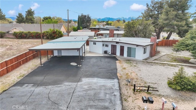 17637 Sultana St, Hesperia, CA 92345 - view of front of property featuring a mountain view, driveway, fence, and an attached carport