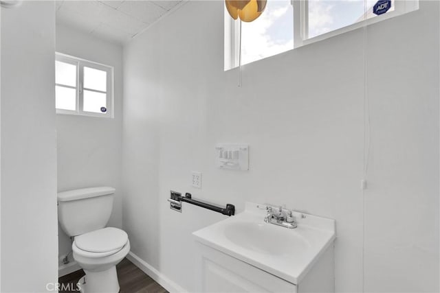 17637 Sultana St, Hesperia, CA 92345 - bathroom featuring toilet, wood finished floors, vanity, and baseboards