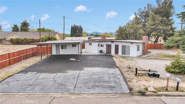 17637 Sultana St, Hesperia, CA 92345 - ranch-style home with an attached carport, driveway, fence, and stucco siding