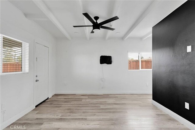 17637 Sultana St, Hesperia, CA 92345 - unfurnished room with light wood-style flooring, baseboards, a ceiling fan, and beam ceiling
