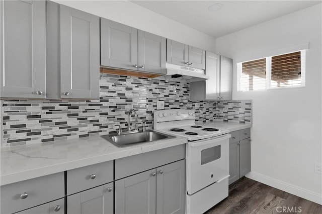 17637 Sultana St, Hesperia, CA 92345 - kitchen with gray cabinets, under cabinet range hood, a sink, and white electric stove