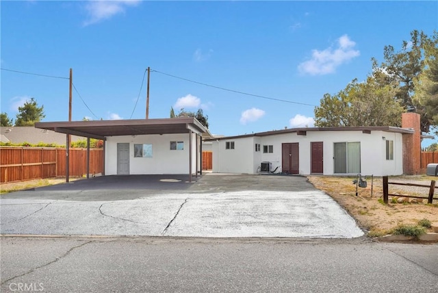 17637 Sultana St, Hesperia, CA 92345 - single story home with a carport, fence, cooling unit, stucco siding, and driveway