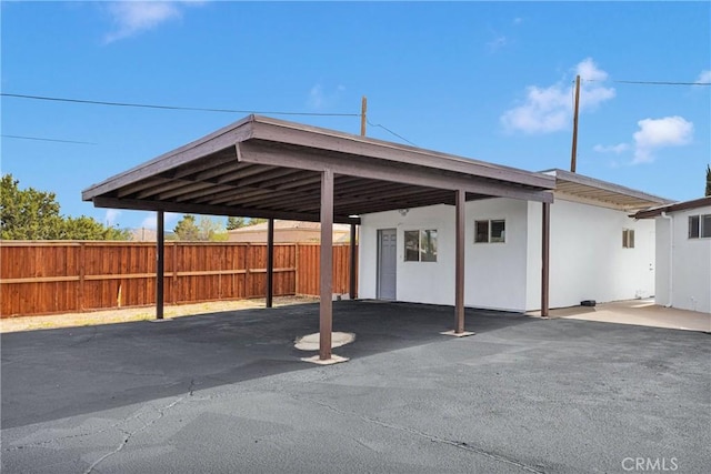 17637 Sultana St, Hesperia, CA 92345 - view of car parking featuring a carport and fence