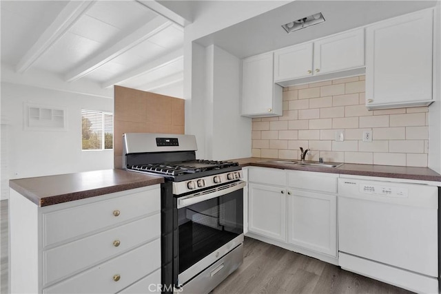 17637 Sultana St, Hesperia, CA 92345 - kitchen featuring dishwasher, dark countertops, beamed ceiling, stainless steel gas range oven, and decorative backsplash