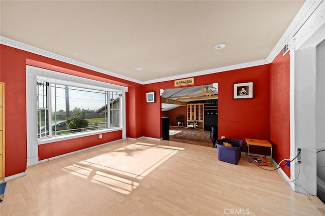 unfurnished room featuring baseboards, recessed lighting, wood finished floors, and ornamental molding