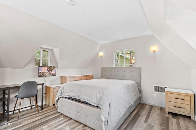 23624 Scenic Dr, Crestline, CA 92325 - bedroom with wood finished floors, vaulted ceiling, and a desk