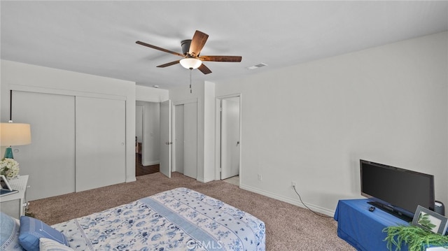 10069 Hershey Way, Riverside, CA 92503 - carpeted bedroom with multiple closets and ceiling fan
