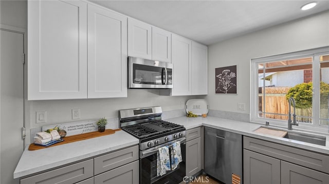 10069 Hershey Way, Riverside, CA 92503 - kitchen featuring appliances with stainless steel finishes, gray cabinets, and white cabinetry