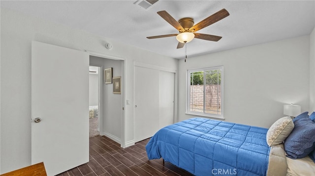 10069 Hershey Way, Riverside, CA 92503 - bedroom featuring dark wood-type flooring, a closet, and ceiling fan