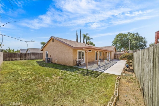 10069 Hershey Way, Riverside, CA 92503 - back of property featuring stucco siding, a fenced backyard, and a patio area