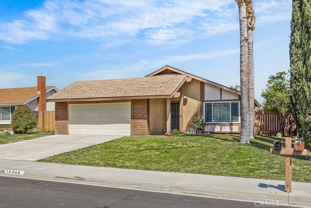 10069 Hershey Way, Riverside, CA 92503 - view of front of home with an attached garage, brick siding, driveway, and stucco siding