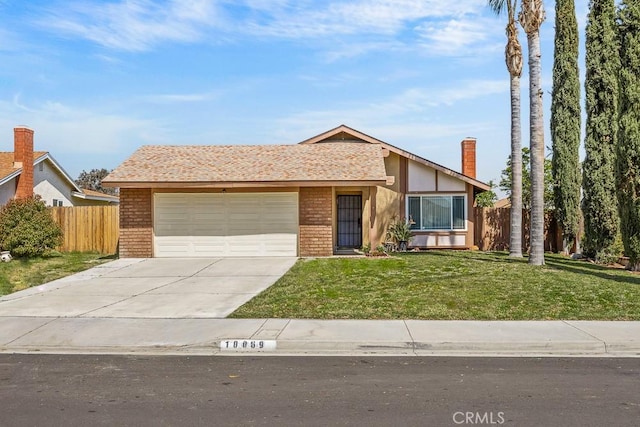 10069 Hershey Way, Riverside, CA 92503 - view of front of home featuring an attached garage, concrete driveway, and brick siding