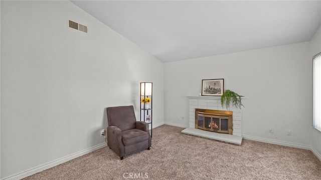 10069 Hershey Way, Riverside, CA 92503 - sitting room featuring a brick fireplace, carpet, healthy amount of natural light, and high vaulted ceiling