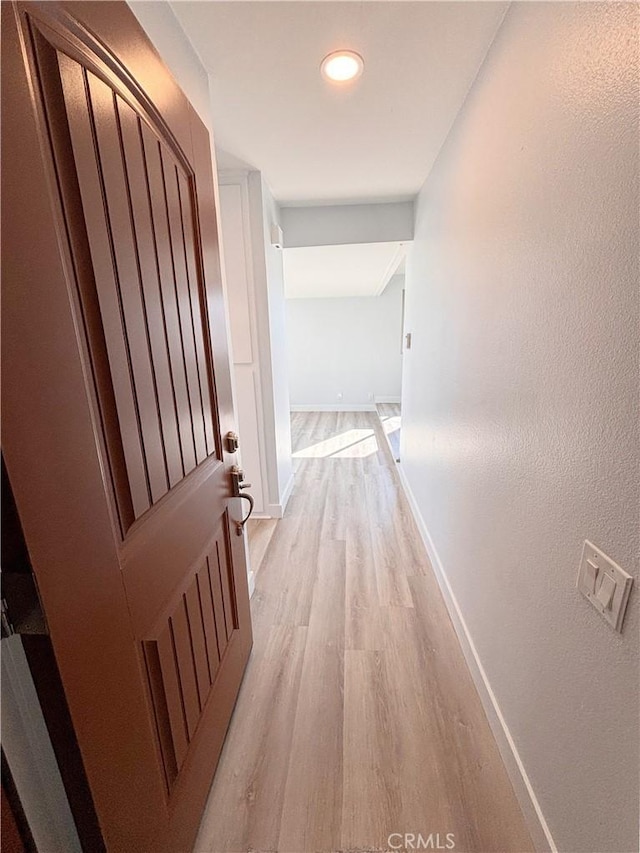 17114 Bluewater Ln Unit 141, Huntington Beach, CA 92649 - hall with light wood-style floors, baseboards, and recessed lighting