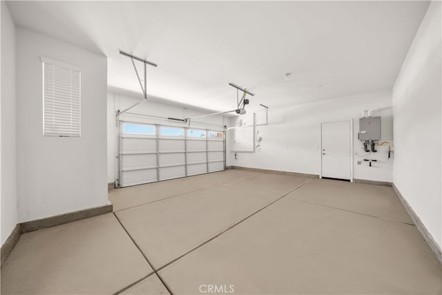 29391 Santa Ynez Cir, Menifee, CA 92584 - garage with a garage door opener, baseboards, and water heater
