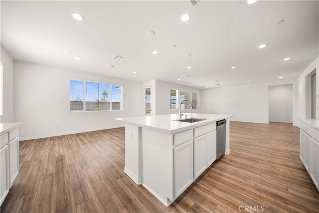 29391 Santa Ynez Cir, Menifee, CA 92584 - kitchen with open floor plan, dishwasher, a sink, and light countertops