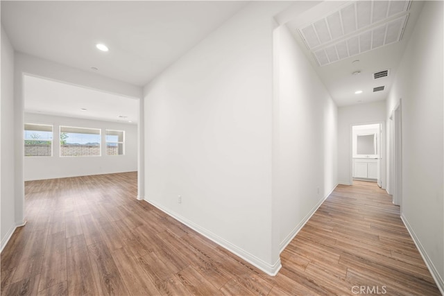 29391 Santa Ynez Cir, Menifee, CA 92584 - hallway with recessed lighting, visible vents, baseboards, and light wood-style flooring